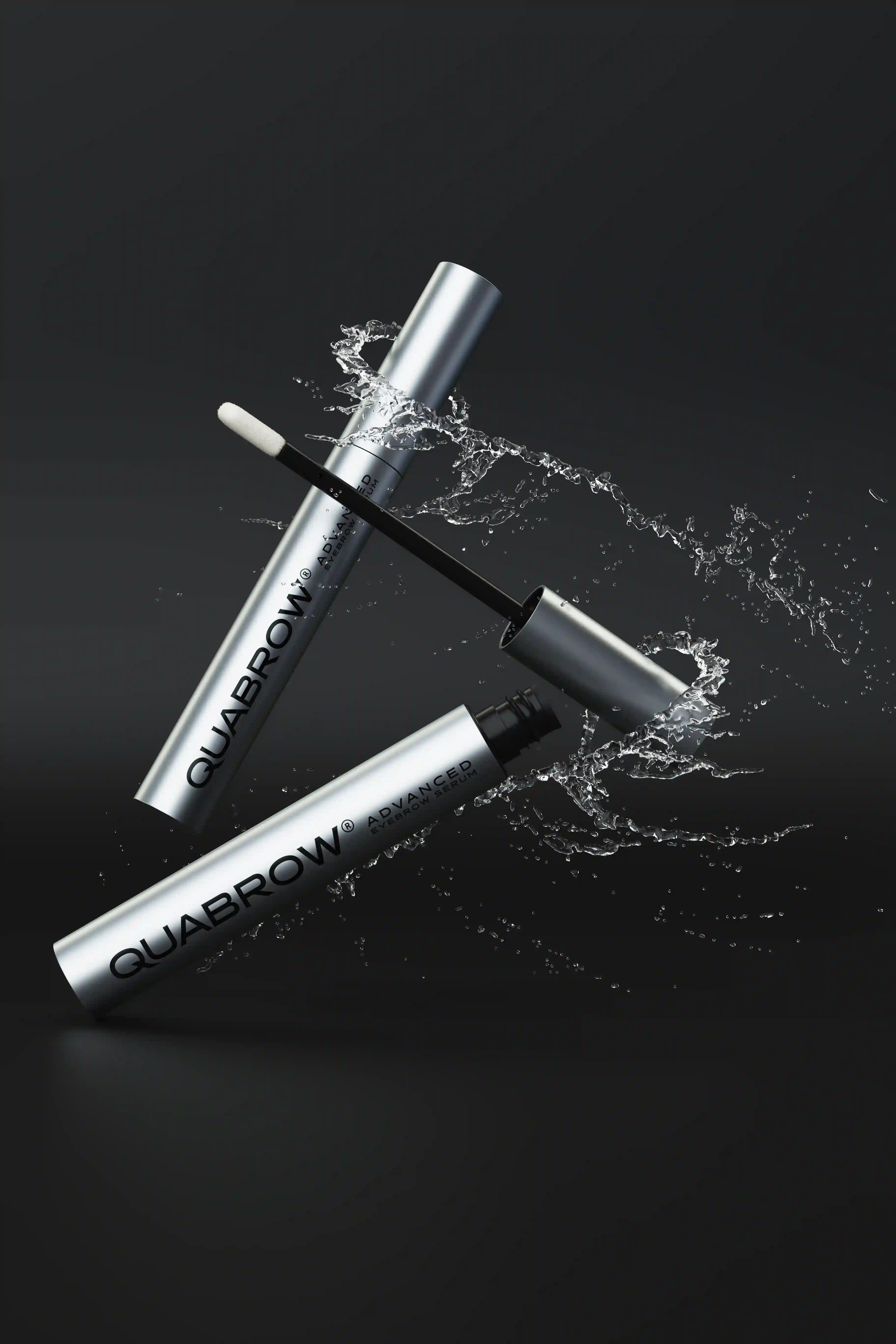 QUABROW Eyebrow Serum DUO SET shown with dynamic water splash effect on a black background