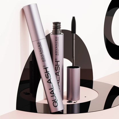 QUALASH Advanced Boost Mascara set displayed on modern artistic black and pink setup